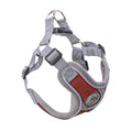 Adjustable dog harness in gray and red, crafted from breathable material, showcasing multiple adjustment straps and rings.