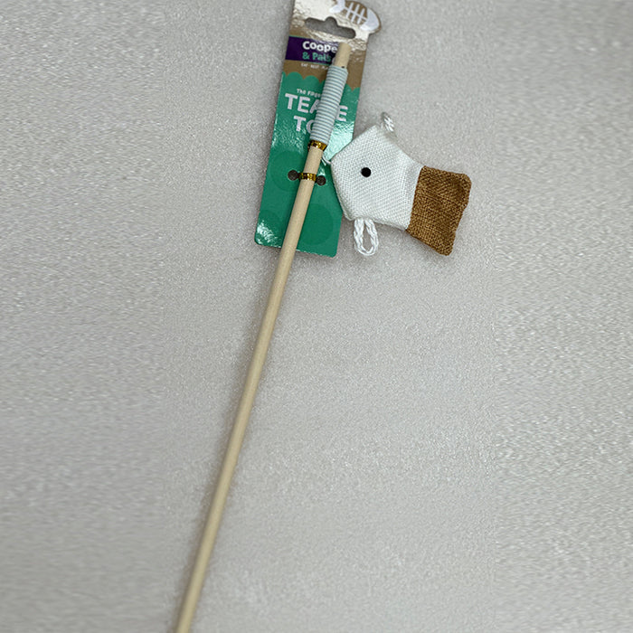 A wooden cat rod featuring a toy fish made of white and brown fabric, displayed with a green packaging tag.