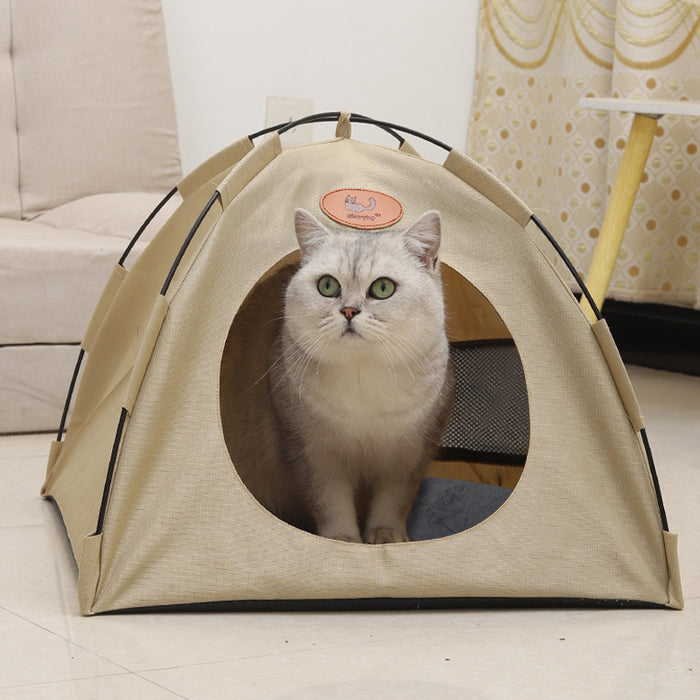 Cozy beige pet tent with a soft bed pad, featuring a large front opening and a curious cat inside.