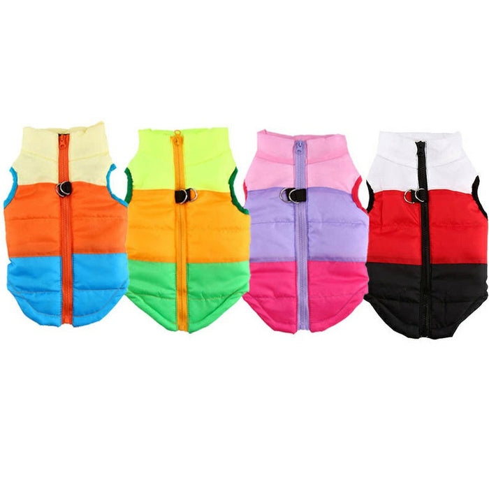 Colorful, puffy winter coats for pets, featuring vibrant panels in orange, green, pink, and black, with zippers.